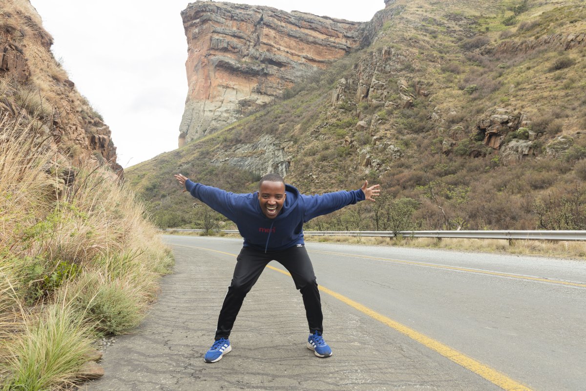 Black man standing in the mountains