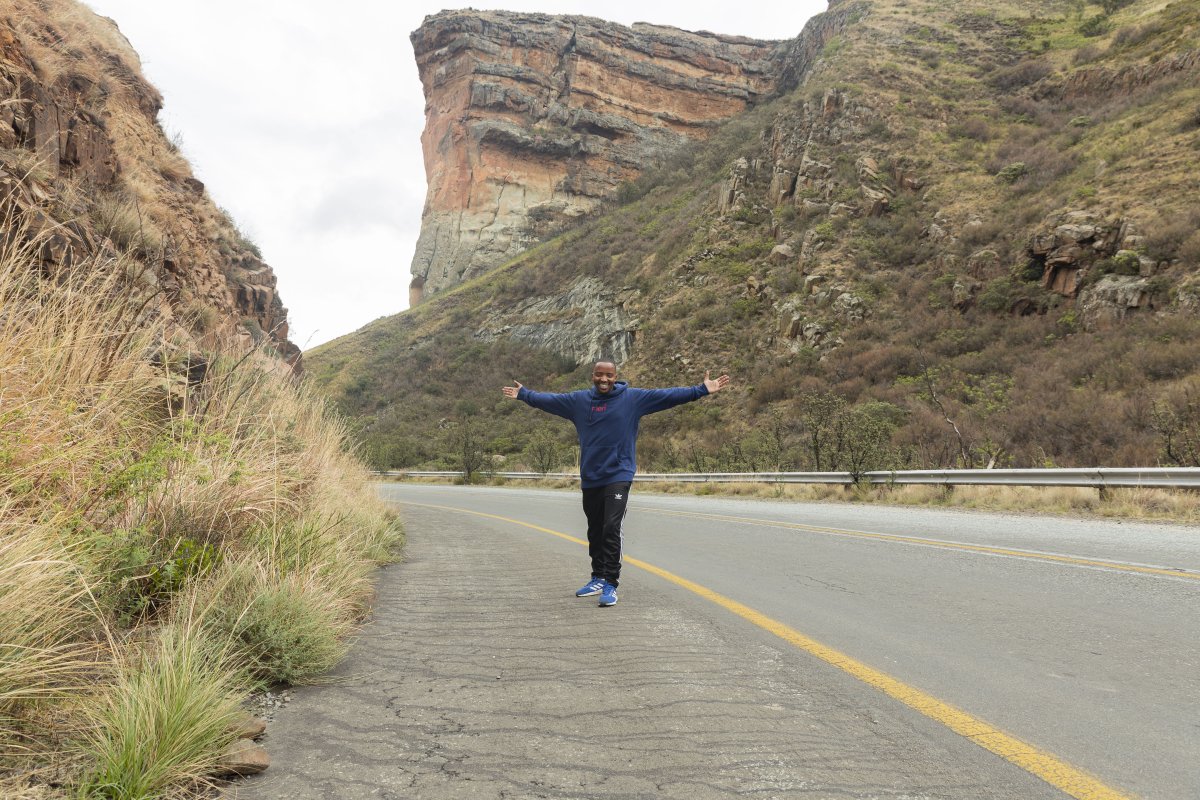 Black man standing in the mountains