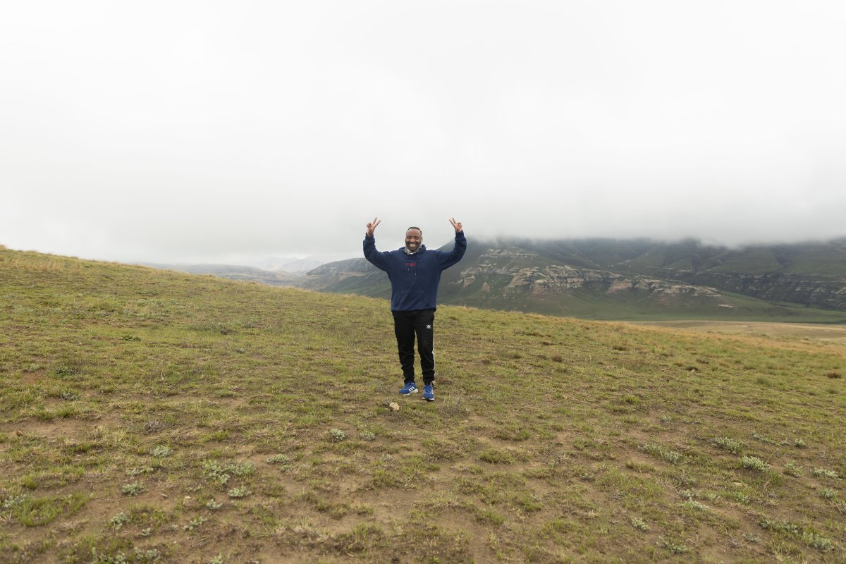 Black man standing in the mountains