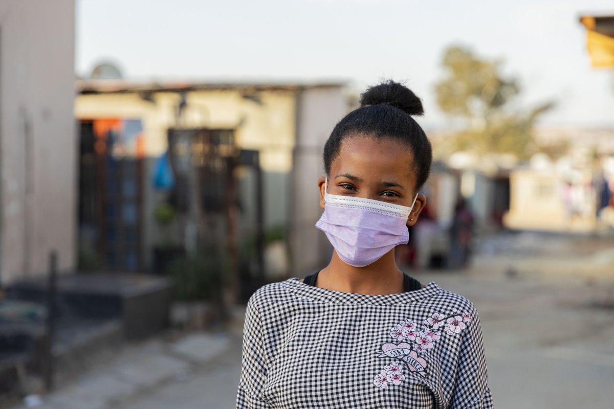 Young black woman wearing mask ekasi