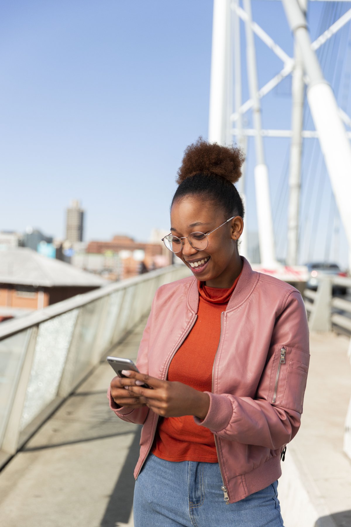 Black woman on a smartphone smiling