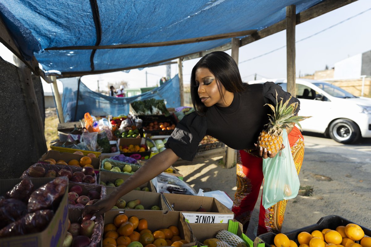 Black woman at the fruit market shopping