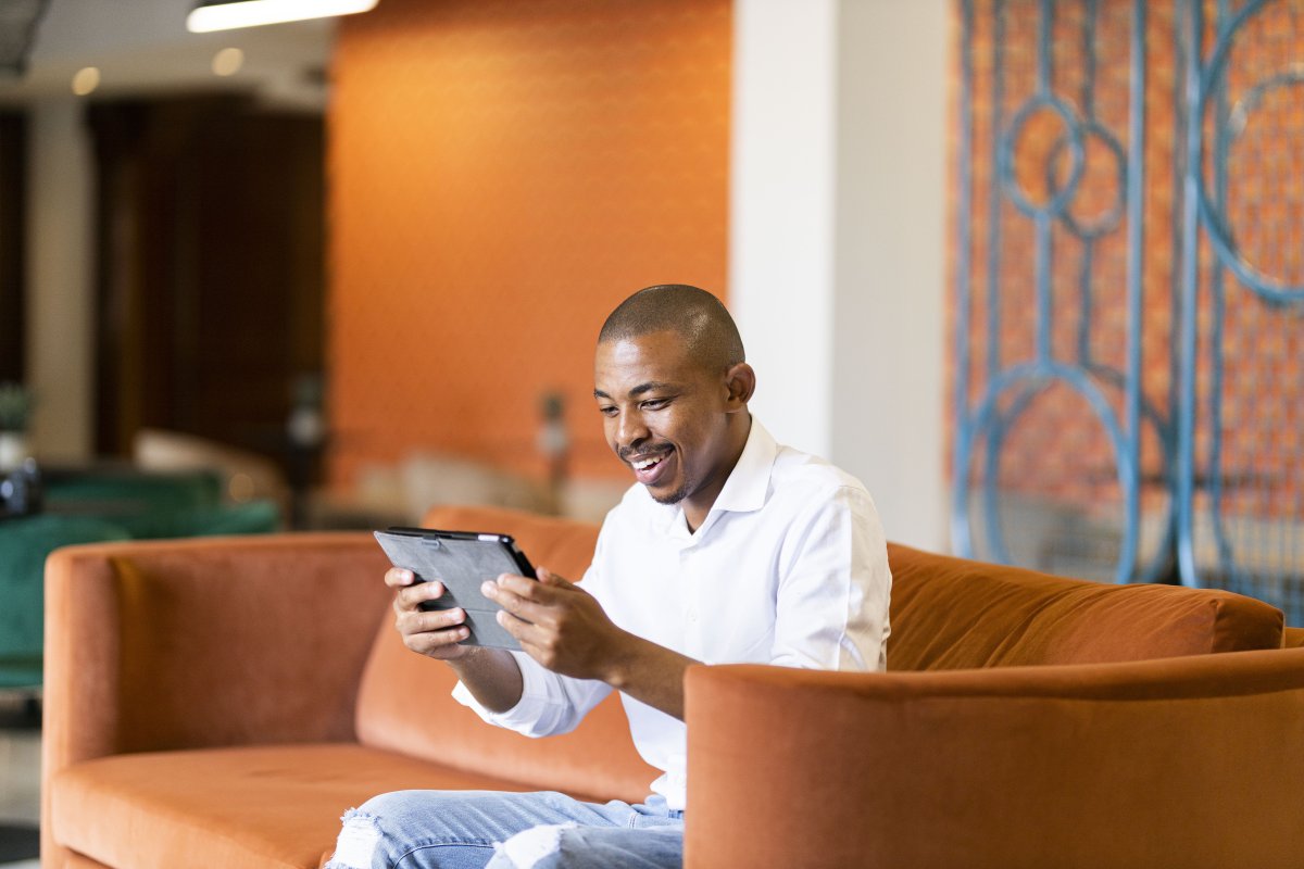 Black man working on ipad