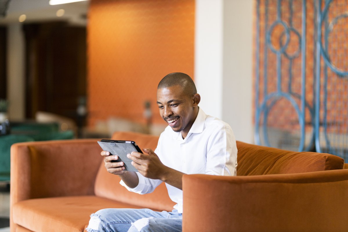 Black man working on ipad