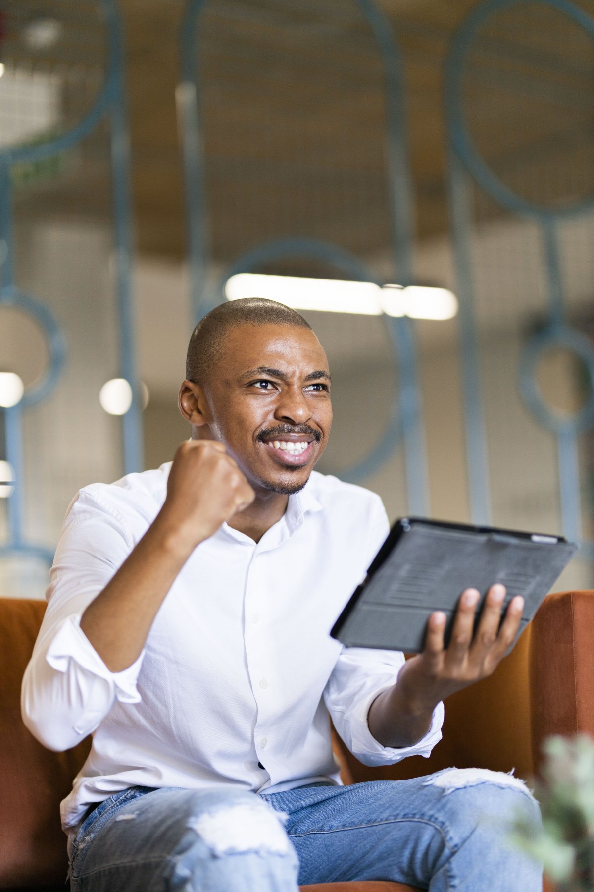 Black man looking at ipad