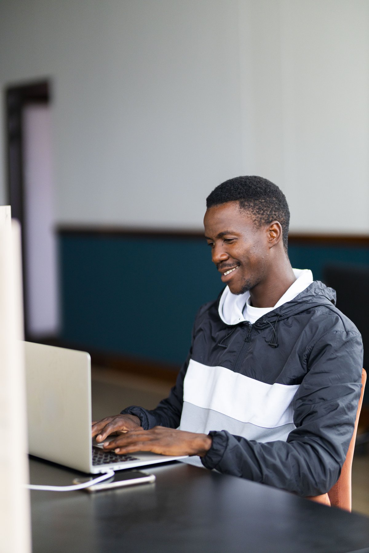Black man working on the laptop at the office