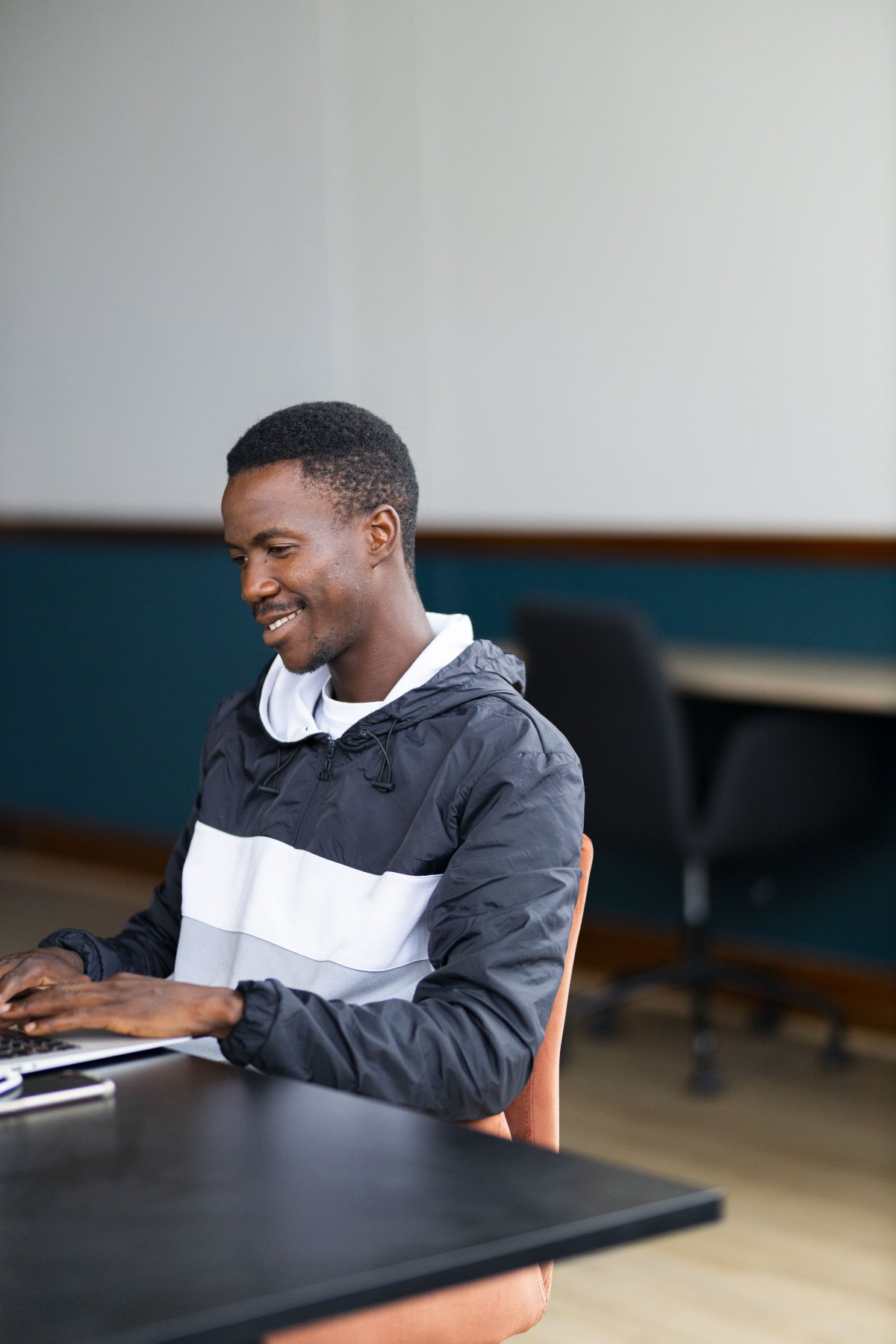 Black man working on the laptop at the office