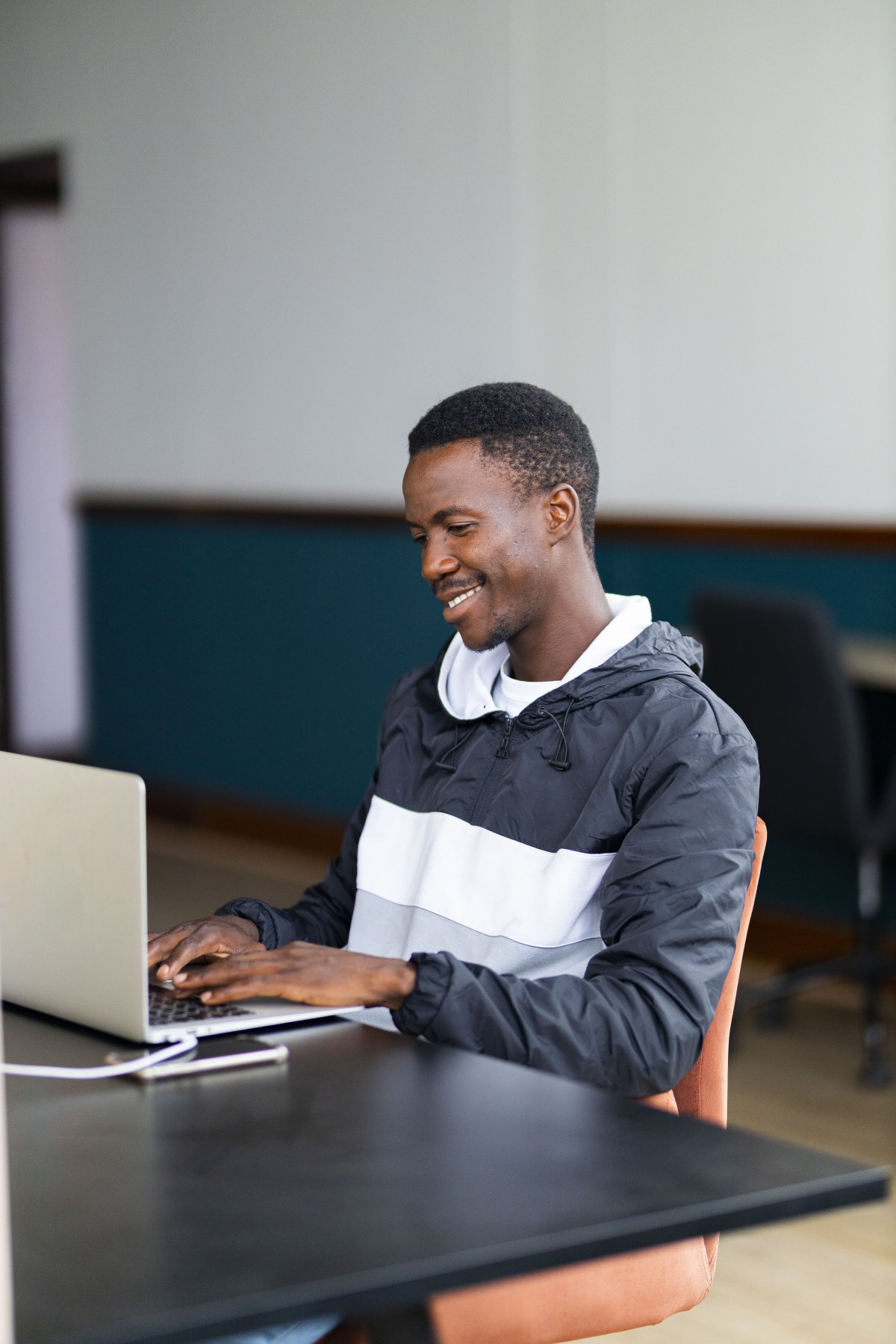 Black man working on the laptop at the office