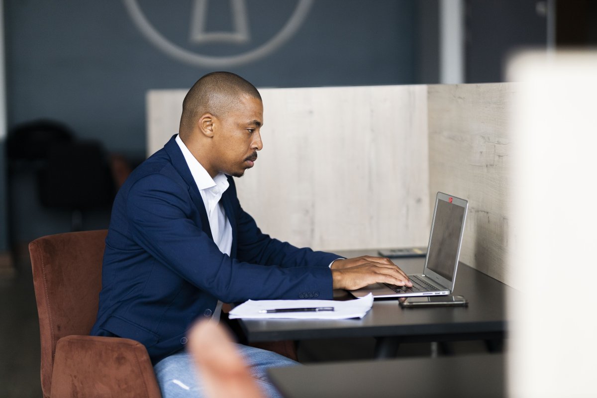 Black business man working on his laptop