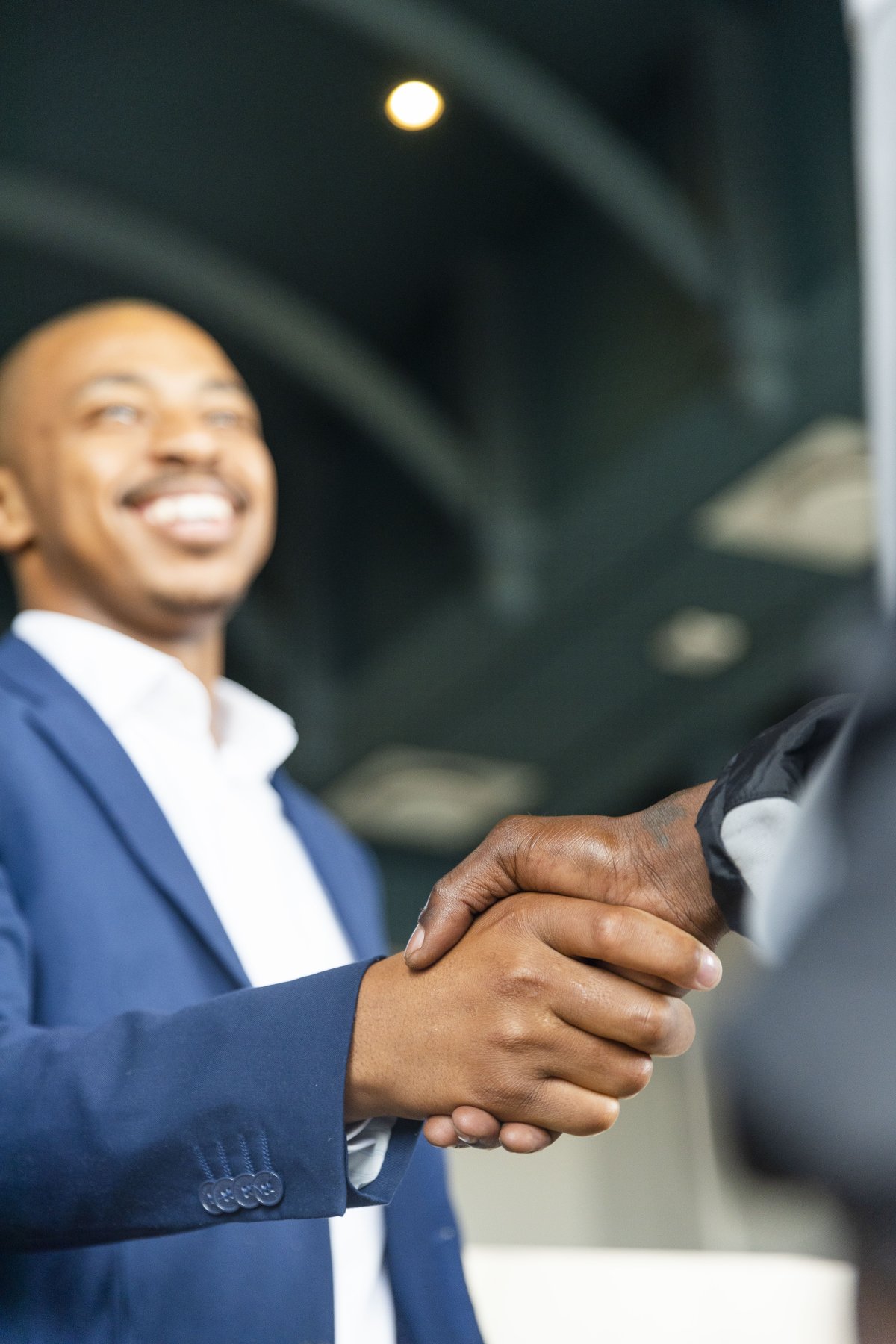 Black business man hand shaking hands with a client