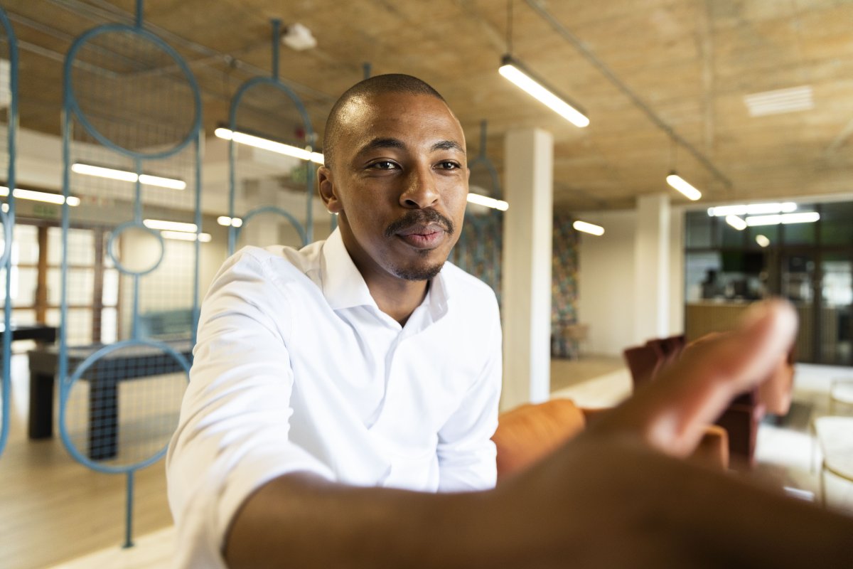 Black business man approaching to shake hands with a client