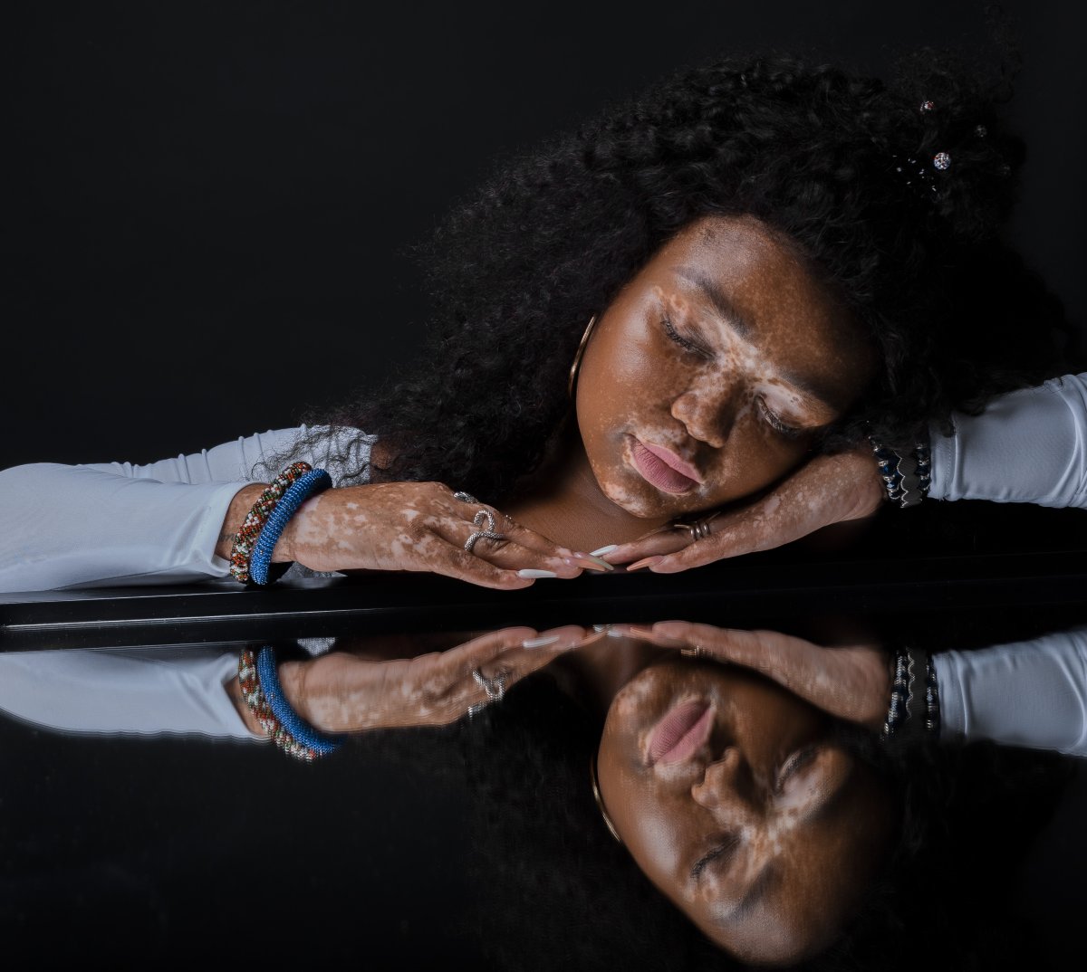 Beautiful model posing with mirror