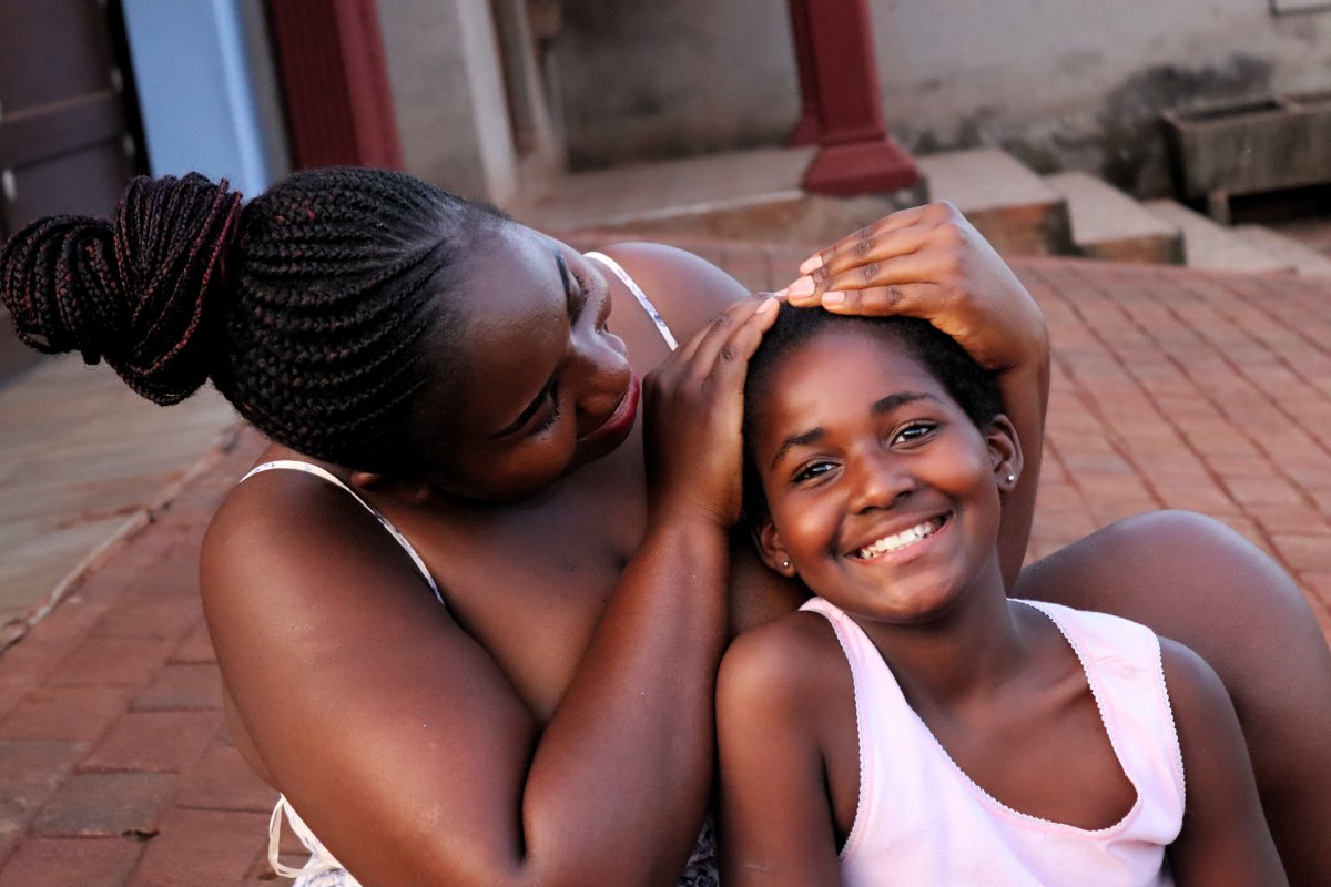 Black woman showing affection to her child