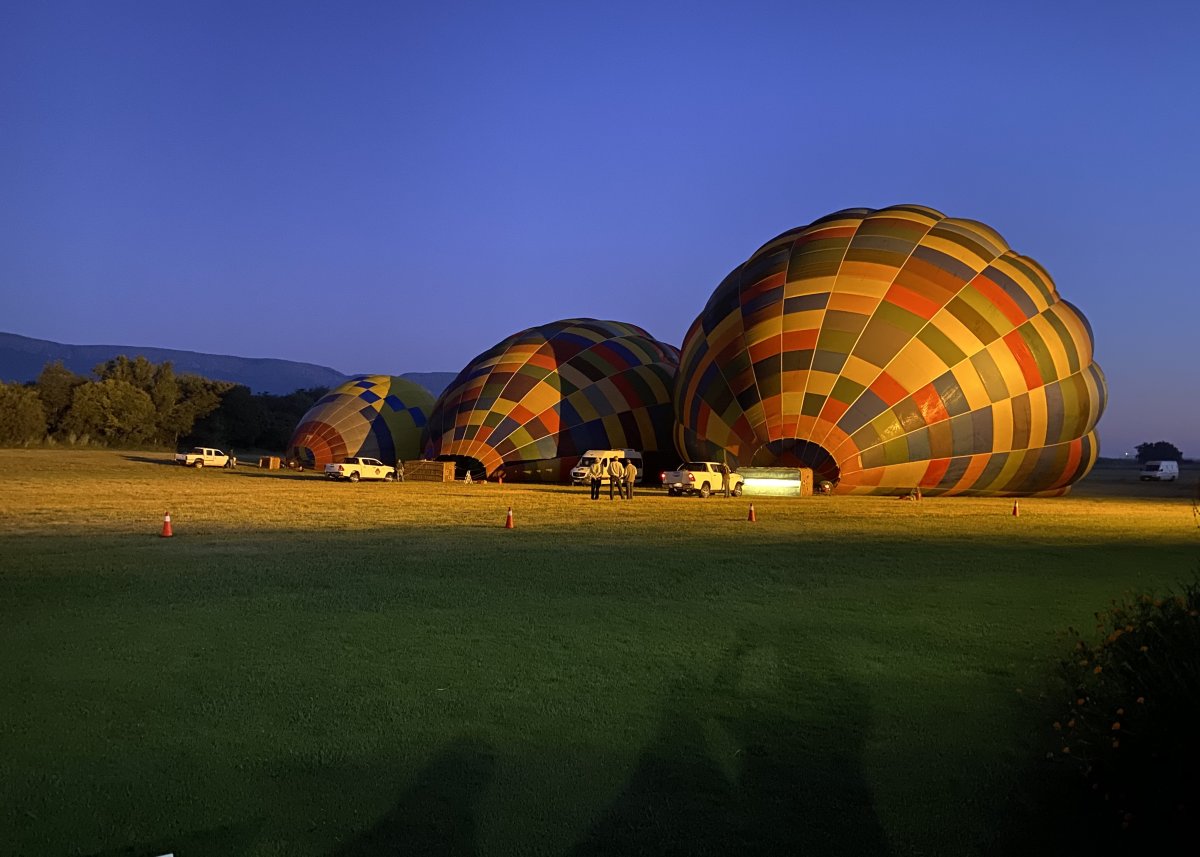 Inflating hot air balloon for a sunrise safari