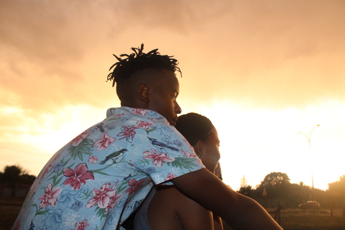 Young couple watching the sunset ekasi