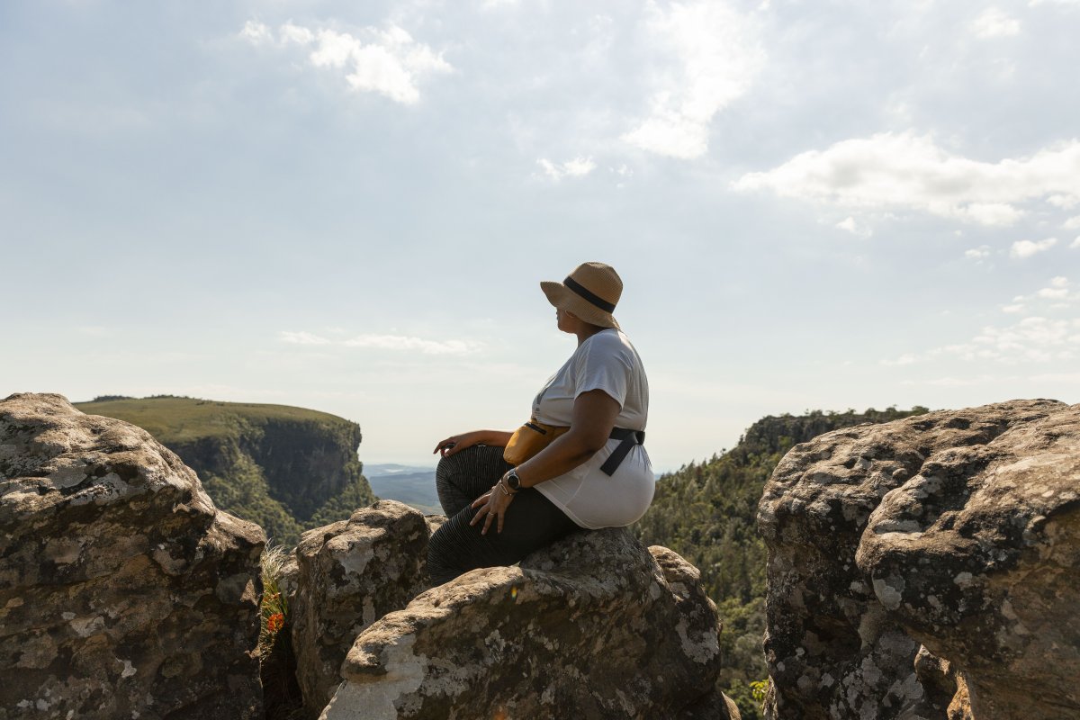 Black woman watching the views of Mpumalanga