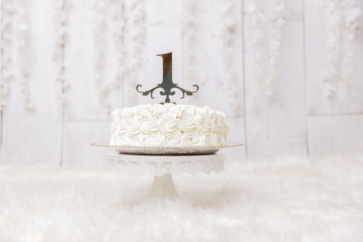 1st birthday cake on a stand