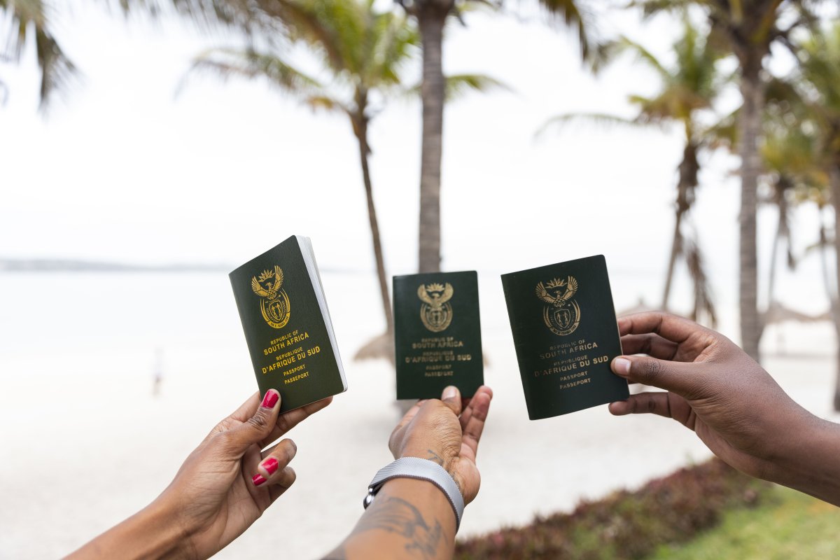 Friends holding South African passports