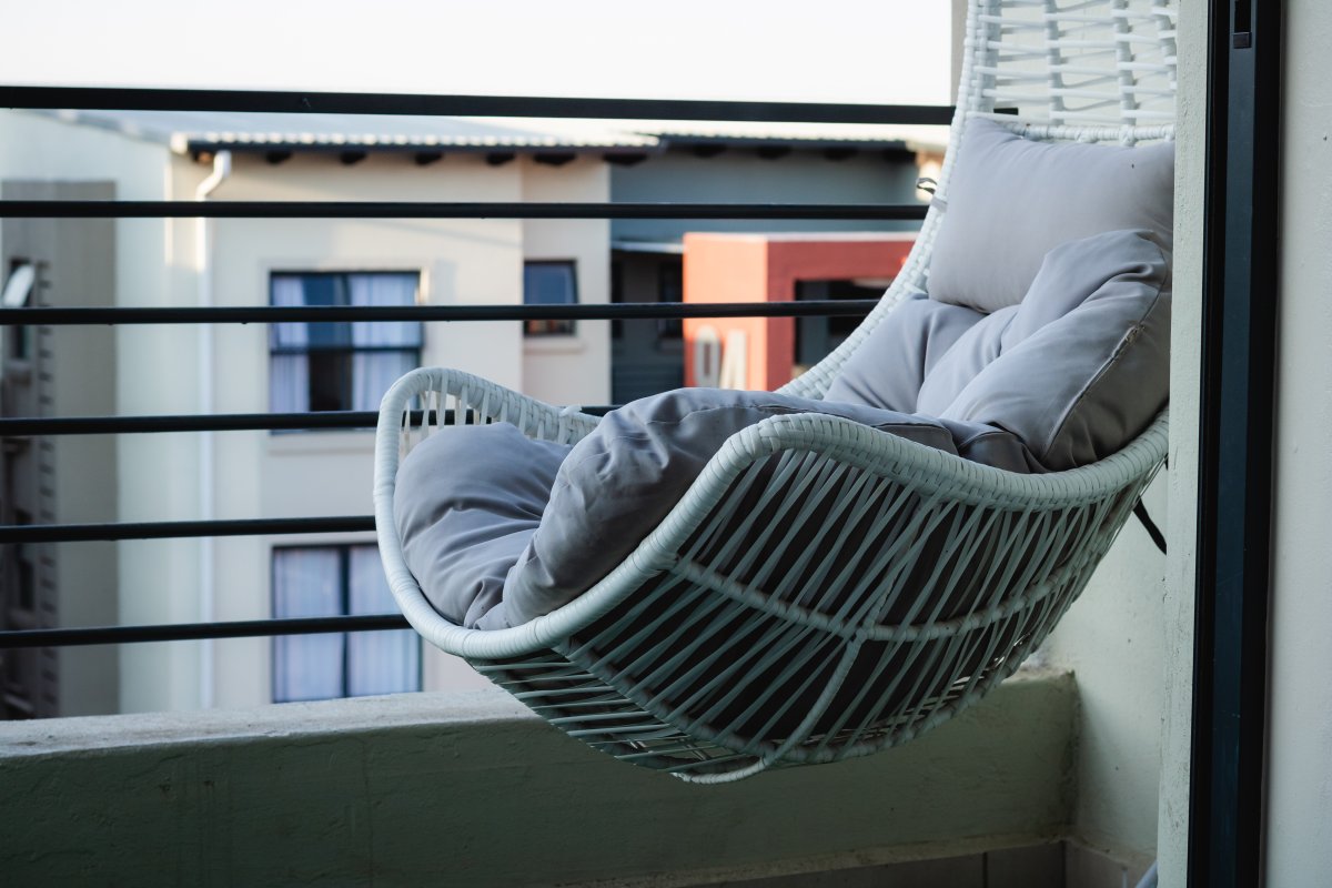 Hanging chair in a town house balcony