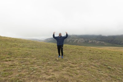 Black man standing in the mountains
