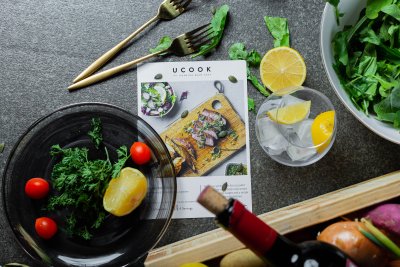 Flatlay of vegetables on a table with wine
