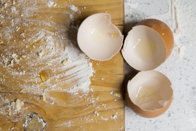 Egg shells on a table with flour