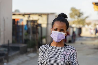 Young black woman wearing mask ekasi