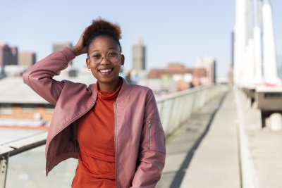 Black woman on Nelson Mandela bridge smiling