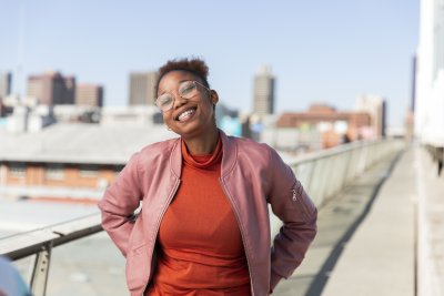 Black woman on Nelson Mandela bridge grinning