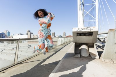 Black woman jumping for joy