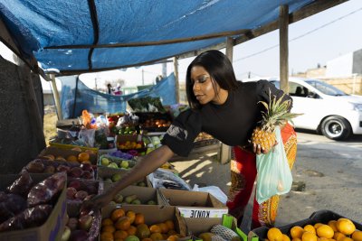 Black woman at the fruit market shopping