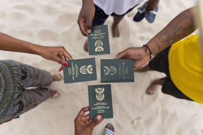 Friends holding South African passports
