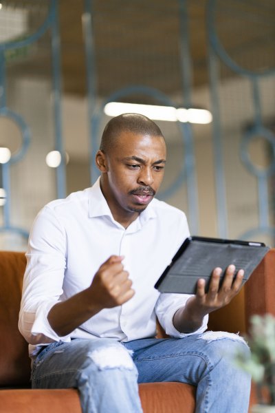 Black man looking at ipad