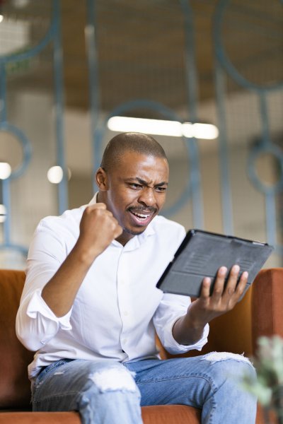 Black man looking at ipad