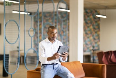 Black man looking at ipad