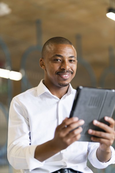Black business man looking at ipad