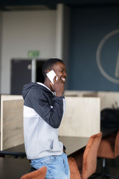 Black man talking on the phone at the office