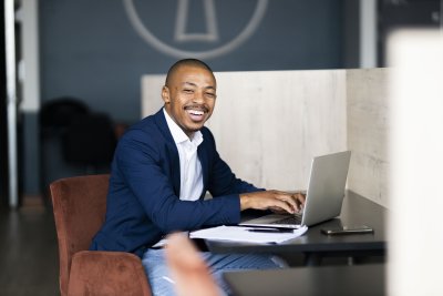 Black business man working from his desk at the office