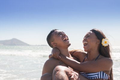 Couple laughing at the beach