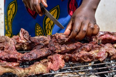Woman cutting meat