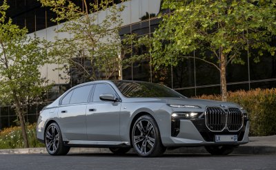 BMW i740i car parked near a building