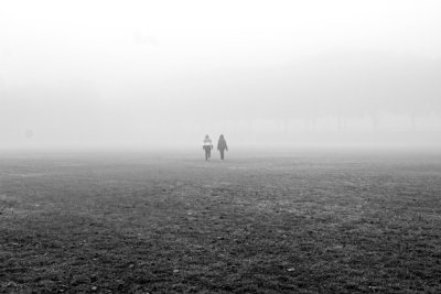 Couple walking in the mist