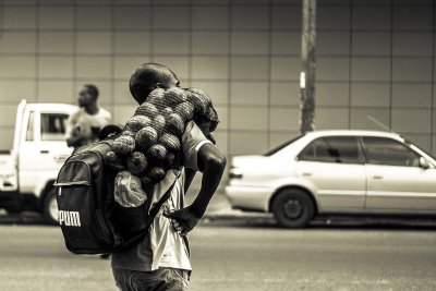 Man carrying a sack of potatoes