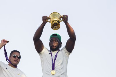 Siya Kholisi holding the Rugby World Cup trophy