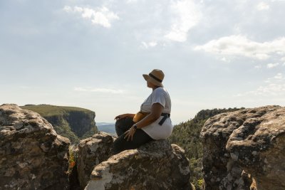 Black woman watching the views of Mpumalanga