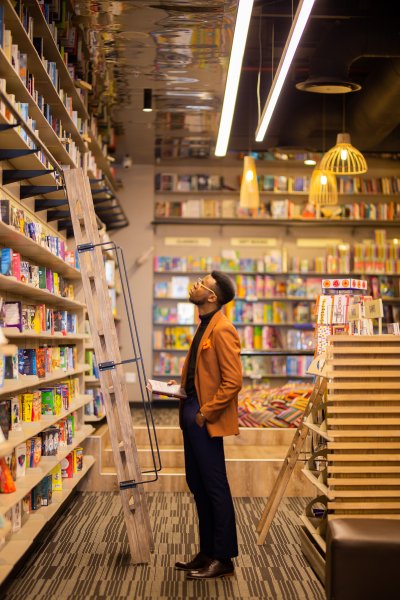 Black male looking at books