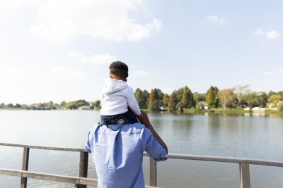 Father and son by the dam