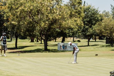 Black golfer putting on the green - Sunshine Tour 10