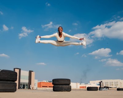 Black athlete jumping in the air